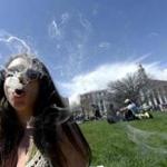 A woman smoked during the 4/20 rally at the Civic Center Park in Denver, where a massive festival was held. 