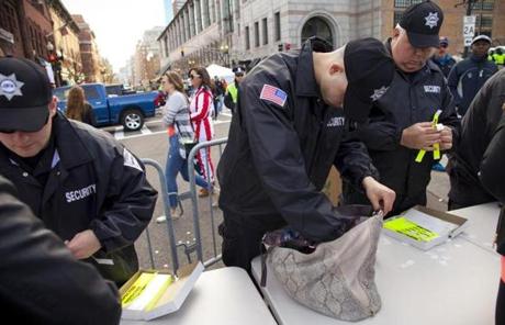 Security officers checked bags that spectators brought onto Boylston Street.
