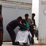 Afghan hospital attendants helped a patient after a shooting at a hospital in Kabul.