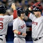 A.J. Pierzynski, right, was congratulated by Mike Carp and Grady Sizemore after hitting a grand slam in the third inning.