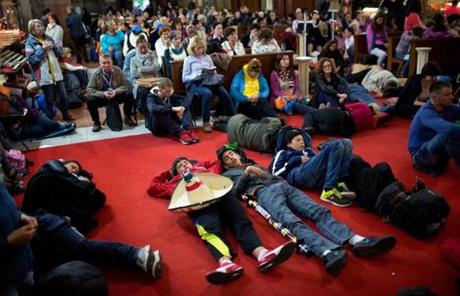 Pilgrims slept inside a church near St. Peter’s Square as they awaited the ceremony.
