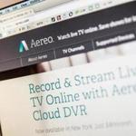 In this photo illustration, Aereo.com, a web service that provides television shows online, is shown on an MacBook Air.