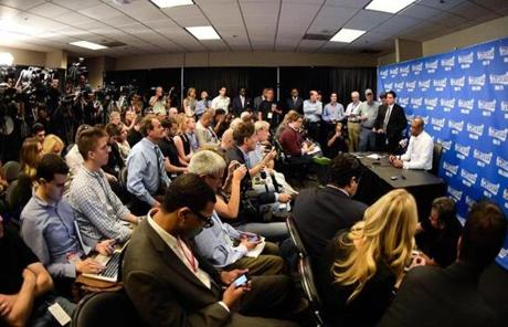 The scene at the press conference.
