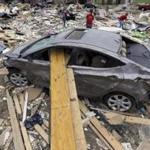 Volunteers gathered items for residents of Vilonia, Ark., whose homes were destroyed by a tornado Sunday. A powerful storm system spawned a chain of tornadoes that killed at least 35 people, flattened homes, and knocked out power in several states. Alabama, Mississippi, and Tennessee were hit Tuesday.