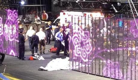 Emergency personnel attended to circus performers who were injured when a metal prop fell during a show.
