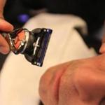 Geoff Edgers tests “Gillette’s new Robocop of a razor” against the old straight-edge.