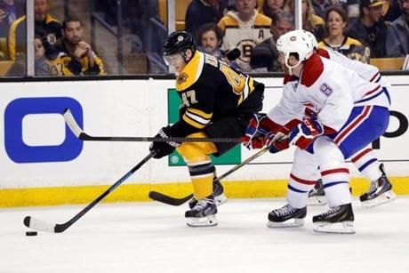 Torey Krug (left) has seen good puck movement on the power play, but the results aren’t there.; Greg M. Cooper USA Today
