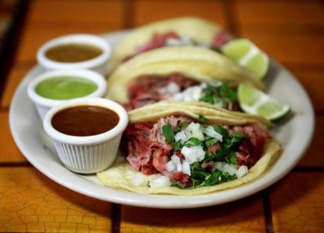 Taqueria Jalisco in East Boston serves carnitas tacos with sauces made from chile de árbol and tomatillo and cilantro.

