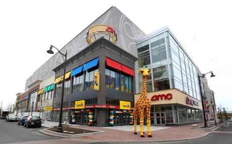 A 20-foot tall giraffe in front of the new Legoland Discovery Center in Somerville's Assembly Row.
