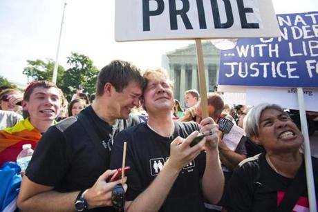 Michael Knaapen (left) and John Becker reacted to the news that the Supreme Court ruled that the Defense of Marriage Act was unconstitutional.

