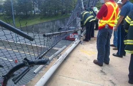 Officials examined damage to the bridge.

