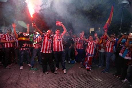 Atlético Madrid fans celebrate in block party fashion on Paseo de los Melancolicos, Madrid, prior to the start of the UEFA Championship final on May 24, 2014. 
