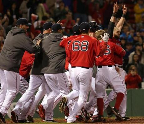 The Red Sox erupted in celebration after A.J. Pierzynski’s triple scored Jonny Gomes for a 3-2 win over the Rays.
