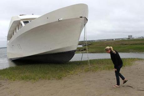 A yacht that ended up on a beach near Alicia Preston’s house in Hampton, N.H., has been the topic of rumors.
