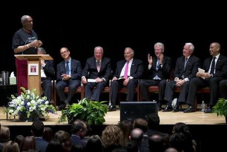 Bill Cosby spoke at the memorial service for Lewis Katz as USSenator Cory Booker, Pennsylvania Governor Tom Corbett, former President Bill Clinton, former Pennsylvania Governor Ed Rendell, Temple University Board of Trustees chairman Patrick O'Connor, and Rabbi Aaron Krupnick loked on.
