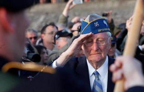 Morley Piper, 90, of Massachusetts, saluted during a D-Day commemoration Friday at Omaha Beach.
