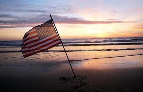 An American flag was planted in the sand of Omaha Beach, France, where Allied troops invaded Nazi-controlled France on June 6, 1944.
