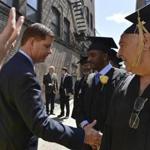 Mayor Martin J. Walsh shook the hand of Sam Bernard (right) as he made his way down the line of graduates at the Pine Street Inn homeless shelter Wednesday.