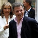 Juan Manuel Santos, pictured with his wife before casting their votes, was re-elected president of Colombia on Sunday.