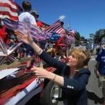 Martha Coakley greeted people on the a parade float.