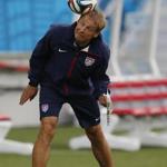 United States coach Jurgen Klinsmann heads a ball during Sunday?s training session. If the US can get out of the Group of Death then ?the sky is the limit,?? said Klinsmann.