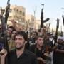 Shi?ite tribal fighters in Baghdad chanted slogans against the Islamic State of Iraq and Syria forces on Monday.