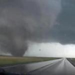A storm packing rare dual tornadoes tore through a tiny farming town in northeast Nebraska, killing a motorist and a 5-year-old girl.