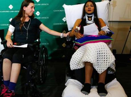 Julissa Segrera reached to take the hand of Dayana Costa as she spoke to the media at Spaulding Rehab in Charlestown.
