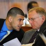 Aaron Hernandez (left) spoke with one of his defense attorneys during a hearing.