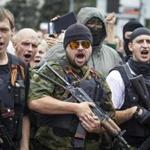 Armed pro-Russian separatists pledge an oath during ceremony Saturday in the eastern Ukraine city of Donetsk.