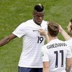 Paul Pogba (19) celebrates with teammates after giving France the lead in the second half vs. Nigeria.