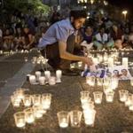 Mourners lit candles in Rabin Square in Tel Aviv after it was announced the bodies of three missing Israeli teenagers had been found.