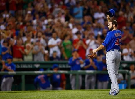 Jake Arrieta acknowledges the cheers from the Fenway crowd after allowing only one Red Sox hit in 7?
 innings. Jared Wickerham/Getty Images
