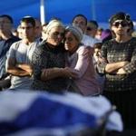 Bat-Galim Shaar (front right), and Iris Yifrach (front second right), mothers of two of the  Israeli teens abducted and killed, mourned during the joint funeral of their sons Tuesday.