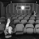 Roger Ebert (front) in the screening room with TV partner Gene Siskel.