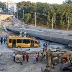 A bus sat damaged next to an unfinished overpass that collapsed in Belo Horizonte, Brazil.