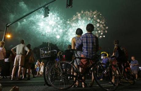 From Massachusetts Avenue in Cambridge, Katie Tong and Ben Morrow watched the fireworks over the Charles River.
