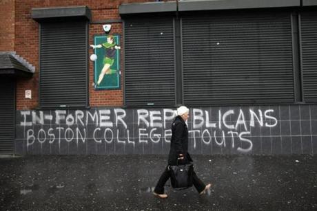 Graffiti along Falls Road in West Belfast, Northern Ireland, refers to former IRA members who took part in Boston College?s IRA oral history.
