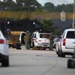 Police officers and SWAT members surrounded an area in Spring, Texas, on Wednesday, following the report of a shooting there.