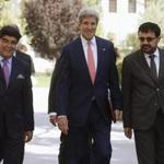 Secretary of State John Kerry walked across the presidential palace grounds with Hamid Siddiq of Afghanistan's Ministry of Foreign Affairs and Foreign Minister Zarar Ahmad Osmani, right. 