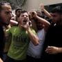 Palestinians chanted on Saturday while carrying the body of a militant who was killed in an Israeli air strike.