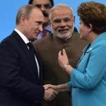 Russian President Vladimir Putin (left) listened to Brazilian President Dilma Rousseff  as India's Prime Minister Narendra Modi looked on during a summit in Fortaleza, Brazil.