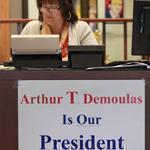 Employees have posted signs inside and outside company headquarters in support of ousted president Arthur T. Demoulas.