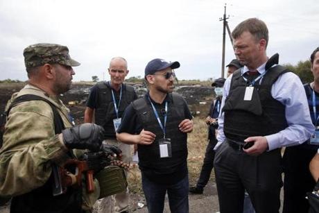 An European monitor spoke with a pro-Russian separatist at the crash site.
