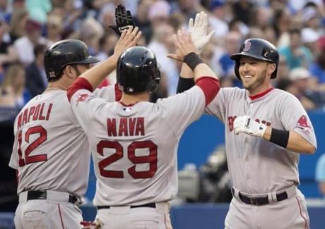 Stephen Drew, right, celebrated his three-run home run with teammates Mike Napoli, left, and Daniel Nava during the third inning.
