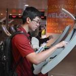Brandon Wu, 19, of Dover used one of Logan International Airport?s self-service customs kiosks. The machine asks passengers basic questions about their items to declare and spits out a receipt. Travelers then finish up with a customs agent. 