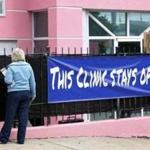An abortion protester called to a patient at the Jackson Women?s Health Organization clinic in Jackson, Miss. Officials did not say if the state would appeal the decision.