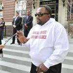 Rev. Moses J. Taylor, father of murder victim Daniel Taylor, spoke to reporters outside a South Boston courthouse.