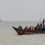 Bangladeshi rescuers searched the River Padma after a ferry capsize in Munshiganj district, Bangladesh, Tuesday, Aug. 5, 2014.