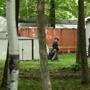A New Hampshire State Trooper walked near a cargo container on the property of Nathaniel Kibby. 